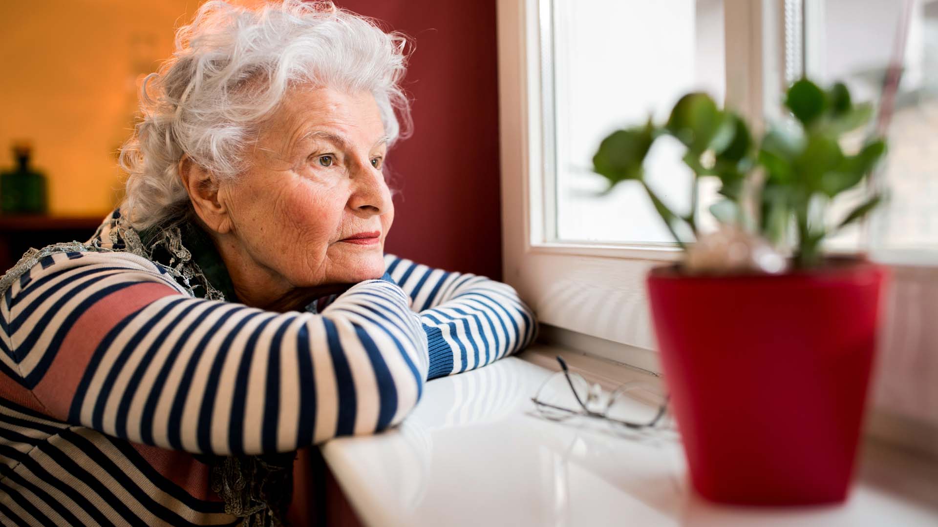 Woman staring out of a window